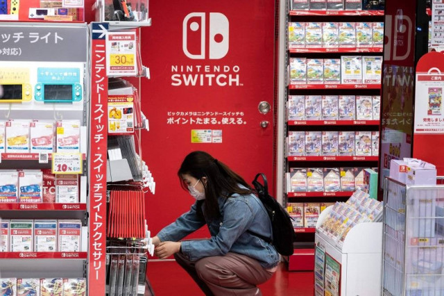 A customer browses the gaming section of Nintendo products in a shop in Tokyo, Japan, May 6, 2021